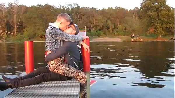 two hot gays kisses each other with passion outdoor