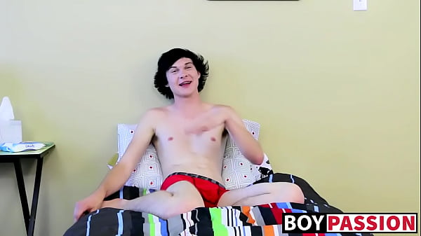 Twink tugs on his massive cock and uses dildo on his ass